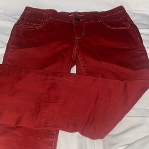 Cute red pants with a small flare but nothing dramatic.